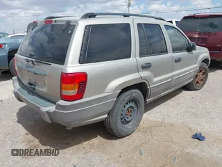 2003 Jeep Grand Cherokee Laredo with VIN 1J4GX48S73C515727, listed as a IAAI auction lot 42555080 with 275,035 mi miles and . Bid and sale history available at DreamBid. Image 4.
