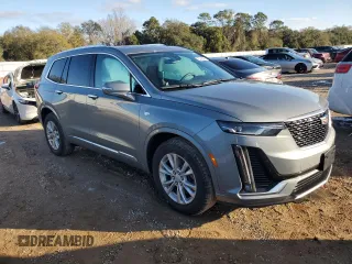 2023 Cadillac XT6 FWD Luxury z VIN 1GYKPAR48PZ115719, wystawiony jako Copart lot #87848435 z przebiegiem 17 597 mil mil oraz Szkoda całkowita • Salvage title. Historia ofert i sprzedaży dostępna na DreamBid. Obrazek 4.