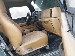 1998 Jeep Wrangler Sport with VIN 1J4FY19S9WP722431, listed as a IAAI auction lot 41872702 with 197,503 mi miles. Bid and sale history available at carsss.com. Image 5.