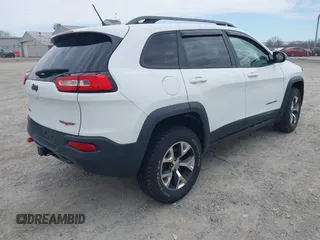 2015 Jeep Cherokee Trailhawk with VIN 1C4PJMBB7FW741365, listed as a IAAI auction lot 41879685 with 94,135 mi miles and . Bid and sale history available at carsss.com. Image 4.