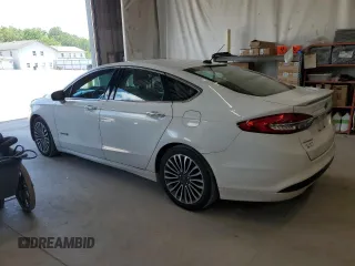 2017 Ford Fusion Hybrid Titanium z VIN 3FA6P0RU3HR400034, wystawiony jako Copart lot #62689795 z przebiegiem 109 118 mil mil oraz Szkoda całkowita • Salvage title. Historia ofert i sprzedaży dostępna na DreamBid. Obrazek 2.