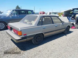 1986 Toyota Camry z VIN JT2SV16E1G0439200, wystawiony jako IAAI lot #42395141 z przebiegiem 159 698 mil mil oraz . Historia ofert i sprzedaży dostępna na DreamBid. Obrazek 4.