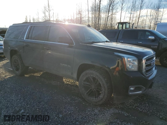 2015 GMC Yukon XL SLT with VIN 1GKS2HKC4FR697416, listed as a Copart auction lot 87887925 with 236,772 mi miles and Salvage Title. Bid and sale history available at carsss.com. Image 4.