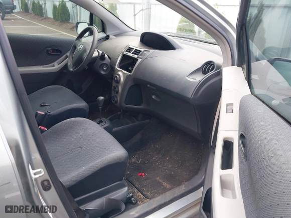 2009 Toyota Yaris with VIN JTDKT903295237216, listed as a IAAI auction lot 42087676 with 158,341 mi miles. Bid and sale history available at carsss.com. Image 5.