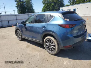 2018 Mazda CX-5 Touring z VIN JM3KFBCM2J1363310, wystawiony jako Copart lot #58969135 z przebiegiem 86 831 mil mil oraz Szkoda całkowita • Salvage title. Historia ofert i sprzedaży dostępna na DreamBid. Obrazek 2.