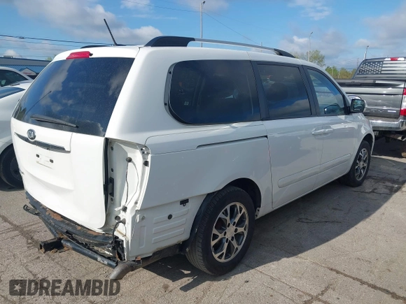 2014 Kia Sedona LX with VIN KNDMG4C75E6545483, listed as a IAAI auction lot 42166152 with 121,827 mi miles and . Bid and sale history available at carsss.com. Image 4.