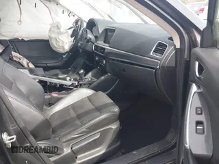 2016 Mazda CX-5 Grand Touring with VIN JM3KE4DY9G0845707, listed as a IAAI auction lot 41709685 with 96,351 mi miles. Bid and sale history available at carsss.com. Image 5.