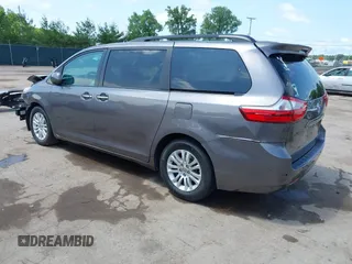 2015 Toyota Sienna XLE with VIN 5TDYK3DCXFS633128, listed as a IAAI auction lot 42527073 with 149,926 mi miles and . Bid and sale history available at DreamBid. Image 3.