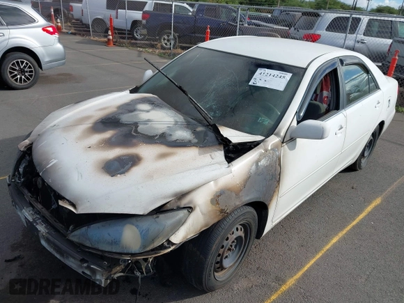 2002 Toyota Camry LE z VIN JTDBE32K120093737, wystawiony jako IAAI lot #41214245 z przebiegiem Nie podano mil oraz . Historia ofert i sprzedaży dostępna na DreamBid. Obrazek 13.