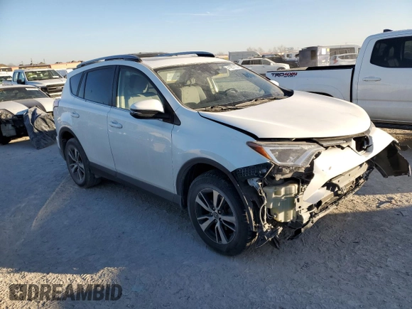 2018 Toyota RAV4 XLE with VIN JTMWFREV7JJ742974, listed as a Copart auction lot 41957735 with 87,005 mi miles and Salvage Title. Bid and sale history available at DreamBid. Image 4.