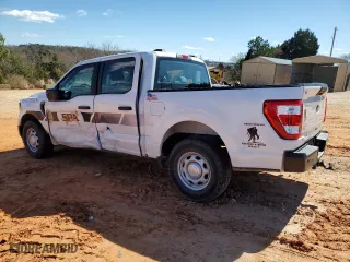 2023 Ford F-150 XL with VIN 1FTEW1CB8PKE69813, listed as a Copart auction lot 82370044 with 23,284 mi miles and Salvage Title. Bid and sale history available at carsss.com. Image 2.
