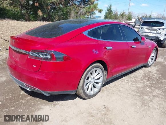 2014 Tesla Model S 60 with VIN 5YJSA1H11EFP37791, listed as a IAAI auction lot 41995504 with 84,371 mi miles and . Bid and sale history available at DreamBid. Image 4.