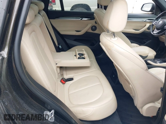 2018 BMW X1 xDrive28i with VIN WBXHT3C34J5K31430, listed as a IAAI auction lot 41954792 with 125,447 mi miles. Bid and sale history available at carsss.com. Image 8.