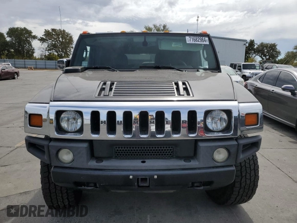 2005 Hummer H2 SUV with VIN 5GRGN23UX5H115383, listed as a Copart auction lot 71682984 with 157,405 mi miles and Salvage Title. Bid and sale history available at carsss.com. Image 5.
