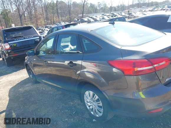 2017 Ford Focus S z VIN 1FADP3E29HL269607, wystawiony jako IAAI lot #41654836 z przebiegiem 101 645 mil mil oraz . Historia ofert i sprzedaży dostępna na DreamBid. Obrazek 14.