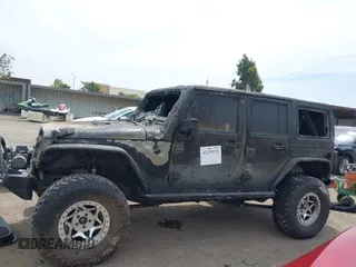 2016 Jeep Wrangler Unlimited Sahara z VIN 1C4HJWEG4GL261147, wystawiony jako IAAI lot #42239252 z przebiegiem 69 604 mil mil oraz . Historia ofert i sprzedaży dostępna na DreamBid. Obrazek 14.