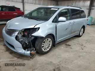 2015 Toyota Sienna XLE with VIN 5TDYK3DC6FS671052, listed as a Copart auction lot 57722255 with 233,668 mi miles and Salvage title. Bid and sale history available at DreamBid. Image 1.