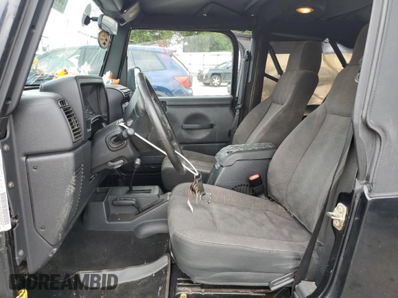 2005 Jeep Wrangler Unlimited with VIN 1J4FA44S75P358246, listed as a Copart auction lot 60958695 with 150,003 mi miles and Salvage title. Bid and sale history available at DreamBid. Image 7.