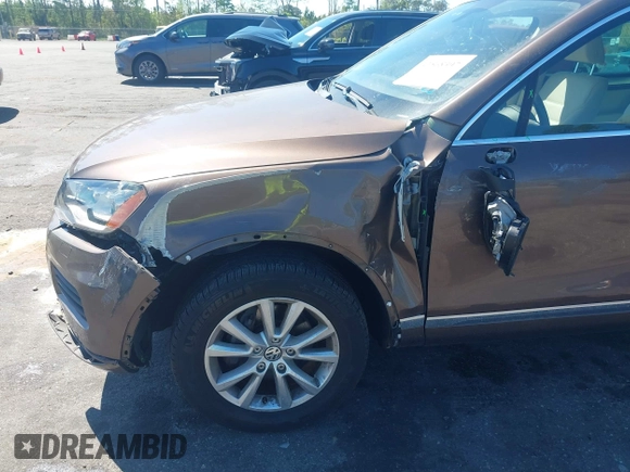 2014 Volkswagen Touareg Sport with VIN WVGEF9BP7ED003525, listed as a IAAI auction lot 41868307 with 74,379 mi miles and . Bid and sale history available at DreamBid. Image 6.