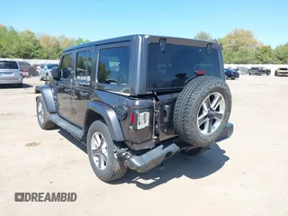 2018 Jeep Wrangler Unlimited Sahara with VIN 1C4HJXEG0JW166645, listed as a IAAI auction lot 42228492 with 58,416 mi miles and . Bid and sale history available at DreamBid. Image 6.