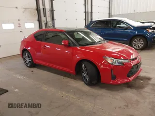 2014 Scion tC with VIN JTKJF5C70E3082772, listed as a IAAI auction lot 41573691 with 98,665 mi miles. Bid and sale history available at carsss.com. Image 1.
