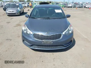 2015 Kia Forte LX with VIN KNAFX4A61F5354649, listed as a IAAI auction lot 42040586 with 113,436 mi miles. Bid and sale history available at carsss.com. Image 6.