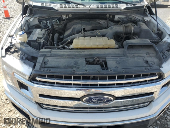 2018 Ford F-150 XL with VIN 1FTEW1EP0JFA28850, listed as a Copart auction lot 63585615 with 210,626 mi miles and Salvage title. Bid and sale history available at DreamBid. Image 11.