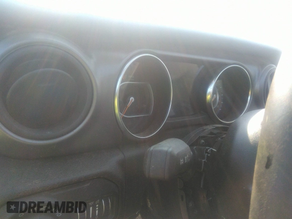 2022 Jeep Gladiator Willys with VIN 1C6HJTAG0NL131004, listed as a IAAI auction lot 40307060 with Not provided miles and . Bid and sale history available at DreamBid. Image 7.