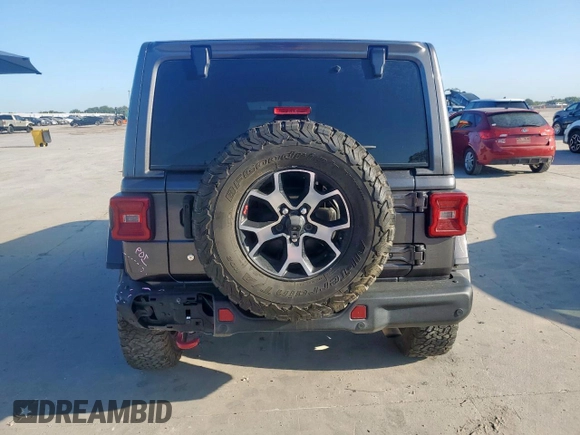 2018 Jeep Wrangler Unlimited Rubicon z VIN 1C4HJXFN3JW236121, wystawiony jako Copart lot #60930565 z przebiegiem 128 727 mil mil oraz Szkoda całkowita • Salvage title. Historia ofert i sprzedaży dostępna na DreamBid. Obrazek 6.