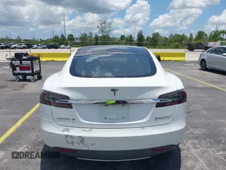 2013 Tesla Model S with VIN 5YJSA1CG4DFP21658, listed as a IAAI auction lot 42398609 with 116,068 mi miles and . Bid and sale history available at DreamBid. Image 16.