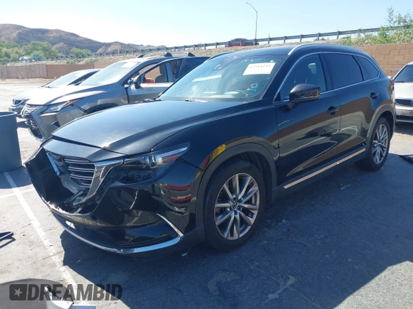 2017 Mazda CX-9 Grand Touring with VIN JM3TCBDY0H0130671, listed as a IAAI auction lot 42514237 with 81,016 mi miles and . Bid and sale history available at DreamBid. Image 2.