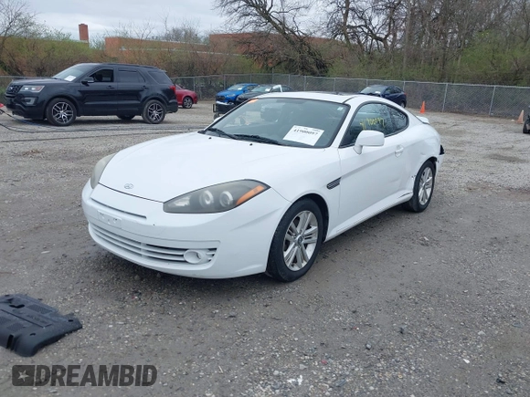 2008 Hyundai Tiburon GS z VIN KMHHM66D58U283273, wystawiony jako IAAI lot #41900097 z przebiegiem 154 013 mil mil oraz . Historia ofert i sprzedaży dostępna na DreamBid. Obrazek 20.