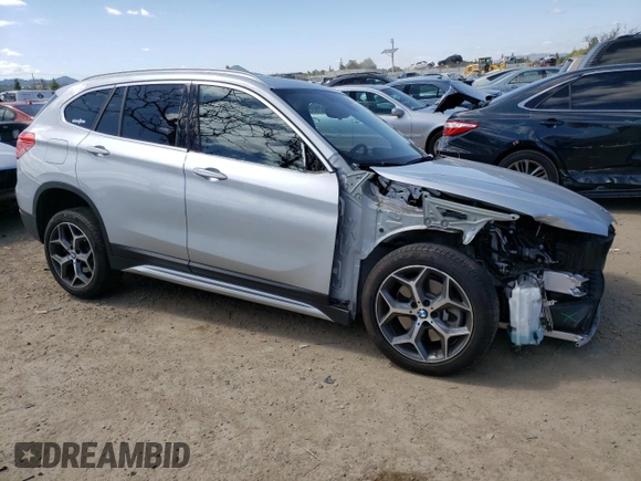 2018 BMW X1 sDrive28i with VIN WBXHU7C38J3H42948, listed as a Copart auction lot 52061793 with 26,991 mi miles and . Bid and sale history available at DreamBid. Image 4.
