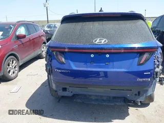 2023 Hyundai Tucson SEL z VIN 5NMJBCAE3PH204442, wystawiony jako IAAI lot #41831450 z przebiegiem 50 812 mil mil oraz . Historia ofert i sprzedaży dostępna na DreamBid. Obrazek 16.