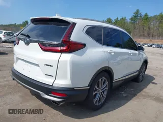 2020 Honda CR-V Touring z VIN 2HKRW2H9XLH623380, wystawiony jako IAAI lot #42039028 z przebiegiem 59 795 mil mil oraz . Historia ofert i sprzedaży dostępna na DreamBid. Obrazek 4.