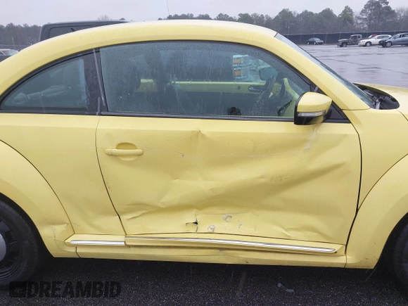 2013 Volkswagen Beetle 2.5L with VIN 3VWHX7AT7DM613197, listed as a IAAI auction lot 41298890 with 130,219 mi miles and . Bid and sale history available at DreamBid. Image 6.