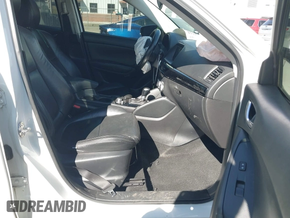 2016 Mazda CX-5 Sport with VIN JM3KE2BY9G0890587, listed as a IAAI auction lot 41685344 with 91,190 mi miles. Bid and sale history available at carsss.com. Image 5.