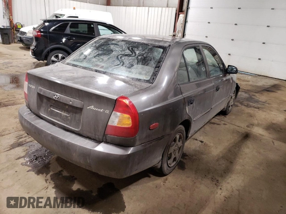 2000 Hyundai Accent z VIN KMHCG45G4YU090520, wystawiony jako Copart lot #79705864 z przebiegiem 145 490 mil mil oraz Szkoda całkowita • Salvage title. Historia ofert i sprzedaży dostępna na DreamBid. Obrazek 3.
