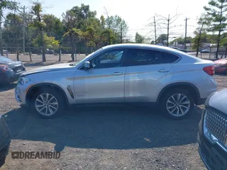 2018 BMW X6 xDrive35i z VIN 5UXKU2C51J0X50507, wystawiony jako IAAI lot #40275236 z przebiegiem 67 523 mil mil oraz . Historia ofert i sprzedaży dostępna na DreamBid. Obrazek 14.