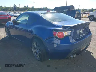 2013 Scion FR-S with VIN JF1ZNAA11D2702415, listed as a IAAI auction lot 40381041 with 63,581 mi miles. Bid and sale history available at carsss.com. Image 3.