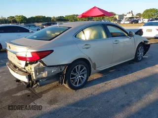 2016 Lexus ES 300h z VIN JTHBW1GG4G2106710, wystawiony jako IAAI lot #41684479 z przebiegiem 144 559 mil mil oraz . Historia ofert i sprzedaży dostępna na DreamBid. Obrazek 4.