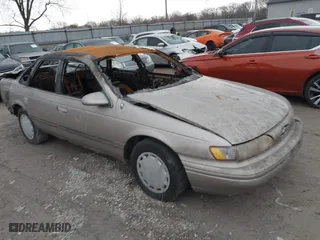 1994 Ford Taurus GL with VIN 1FALP52U6RA258445, listed as a IAAI auction lot 41512672 with 1 mi miles. Bid and sale history available at carsss.com. Image 1.