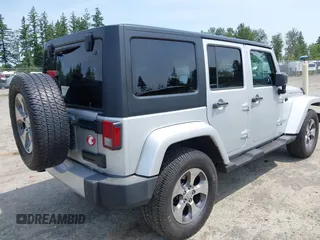 2012 Jeep Wrangler Unlimited Altitude with VIN 1C4HJWEG2CL140059, listed as a IAAI auction lot 42433563 with 189,868 mi miles and . Bid and sale history available at DreamBid. Image 4.