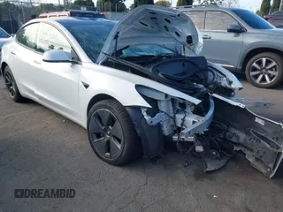 2021 Tesla Model 3 Standard Range Plus z VIN 5YJ3E1EA0MF022920, wystawiony jako IAAI lot #41699406 z przebiegiem 31 466 mil mil oraz . Historia ofert i sprzedaży dostępna na DreamBid. Obrazek 1.