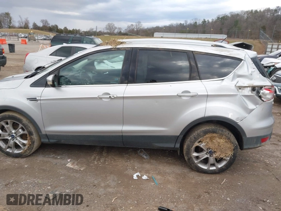 2014 Ford Escape Titanium with VIN 1FMCU9J94EUE51012, listed as a IAAI auction lot 41497105 with 153,031 mi miles. Bid and sale history available at carsss.com. Image 13.