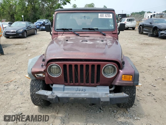 2002 Jeep Wrangler X z VIN 1J4FA39S42P773815, wystawiony jako Copart lot #60016255 z przebiegiem 174 803 mil mil oraz Szkoda całkowita • Salvage title. Historia ofert i sprzedaży dostępna na DreamBid. Obrazek 5.