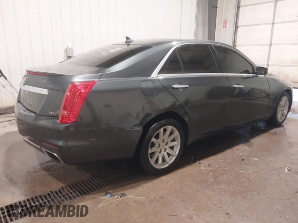 2014 Cadillac CTS Luxury AWD with VIN 1G6AX5S37E0172041, listed as a IAAI auction lot 40343343 with 102,506 mi miles and . Bid and sale history available at DreamBid. Image 4.