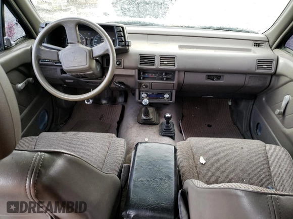 1992 Isuzu Rodeo z VIN 4S2CY58Z2N4333410, wystawiony jako Copart lot #74507154 z przebiegiem 264 327 mil mil oraz Szkody całkowita. Historia ofert i sprzedaży dostępna na DreamBid. Obrazek 8.