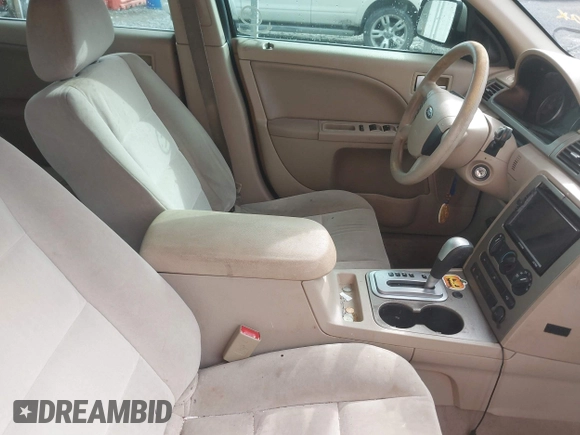 2005 Ford Five Hundred SE z VIN 1FAFP23145G127490, wystawiony jako IAAI lot #42122316 z przebiegiem 202 975 mil mil oraz . Historia ofert i sprzedaży dostępna na DreamBid. Obrazek 5.