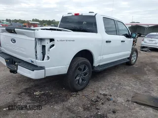 2024 Ford F-150 Lightning XLT with VIN 1FTVW3LKXRWG01185, listed as a IAAI auction lot 41679606 with 4,961 mi miles and . Bid and sale history available at DreamBid. Image 4.